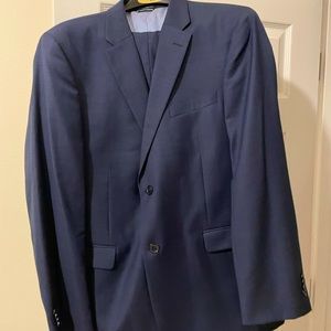 Tommy Hilfiger Suit. Color is navy blue and the jacket size is 42R, pants 34x32.